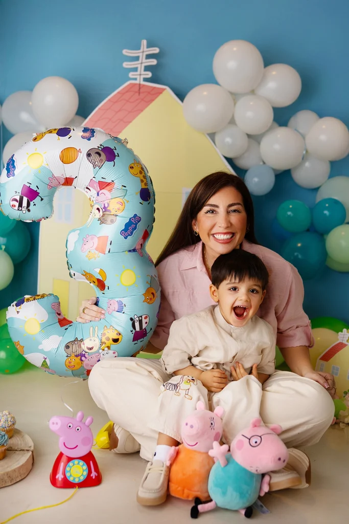 Mother and son together during a colourful third birthday photography session in Enfield, North London