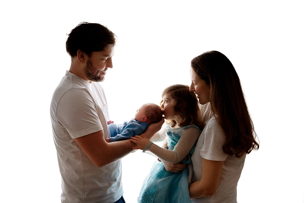Parents holding their newborn baby during a newborn family photography session in Enfield, North London