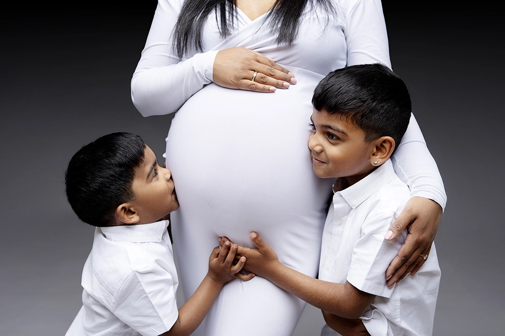 Maternity photography with siblings in Enfield, North London – two boys with their pregnant mum