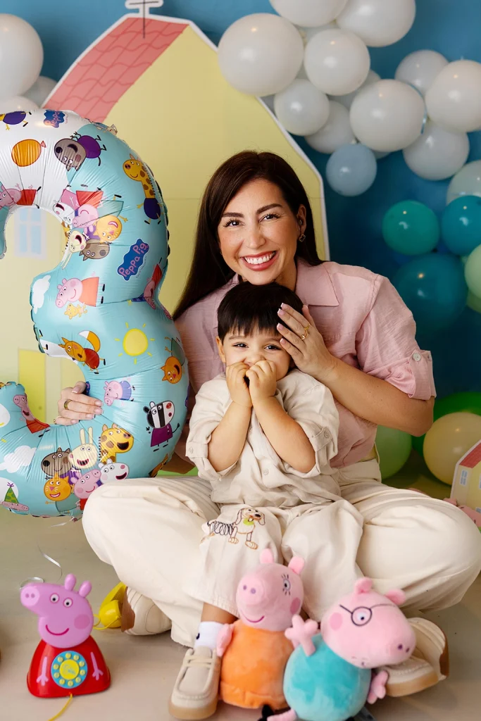 Mother cuddling her son during his third birthday photography session in Enfield, North London