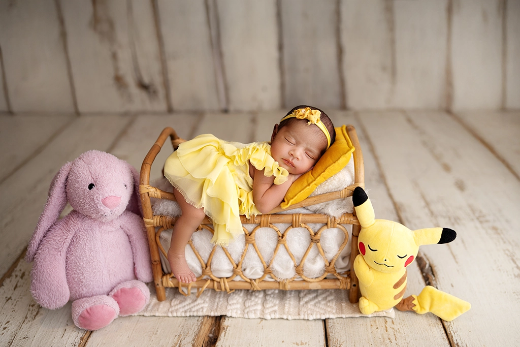 Newborn baby photographed with soft toys during a newborn photography session in Enfield, North London