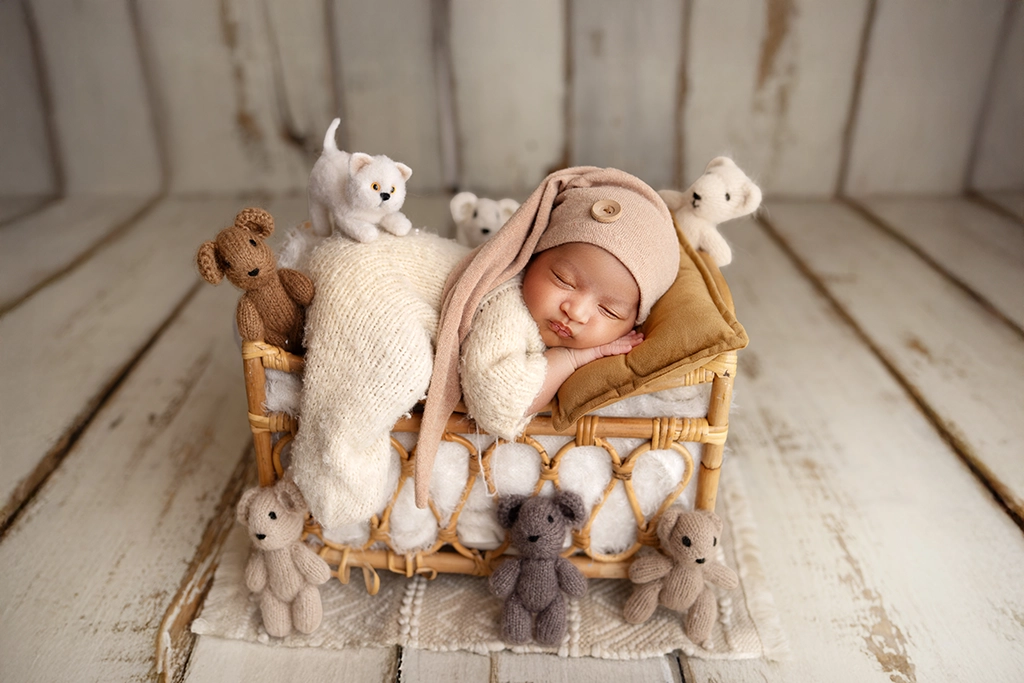Newborn photography London – baby boy sleeping in a styled bed setup