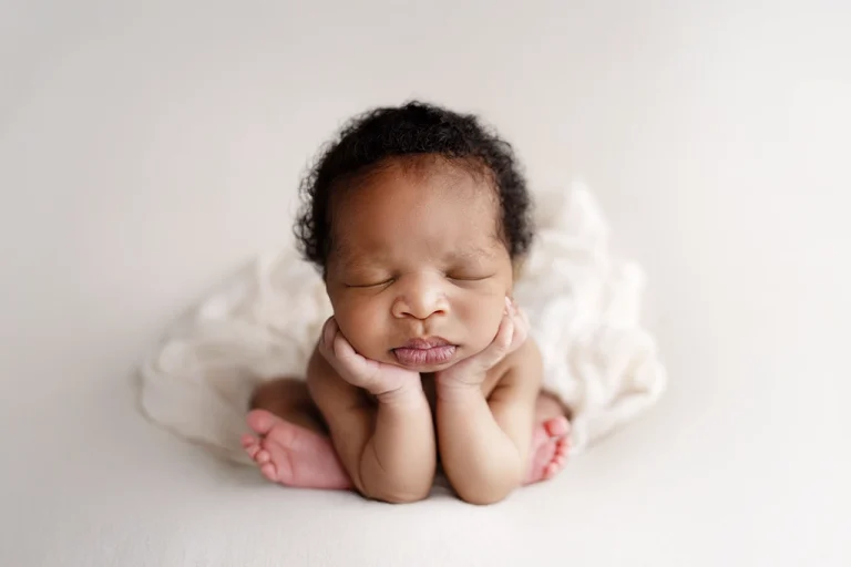 Professional newborn photoshoot in Enfield, North London with a newborn baby photographed in a studio