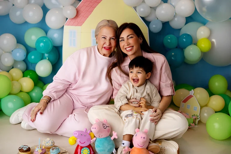 Three-generation family portrait of a grandmother, mother and grandson photographed in Enfield, North London