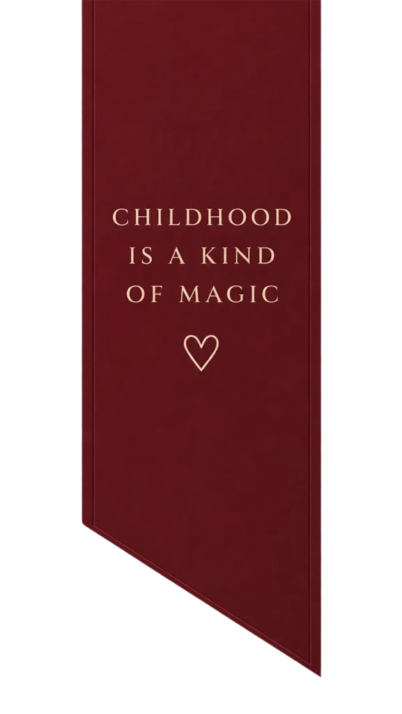 Burgundy Christmas ribbon with the text Childhood Is a Kind of Magic