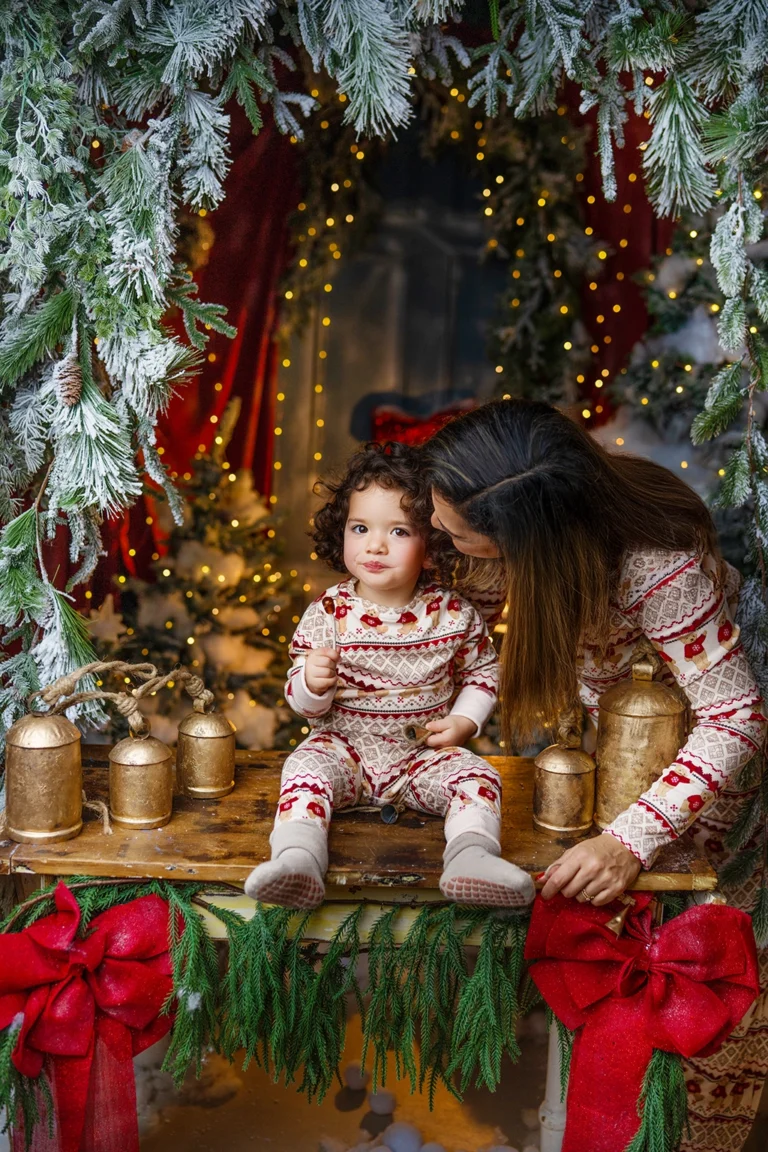 Mother with her young child during a Christmas photography session in Enfield, North London