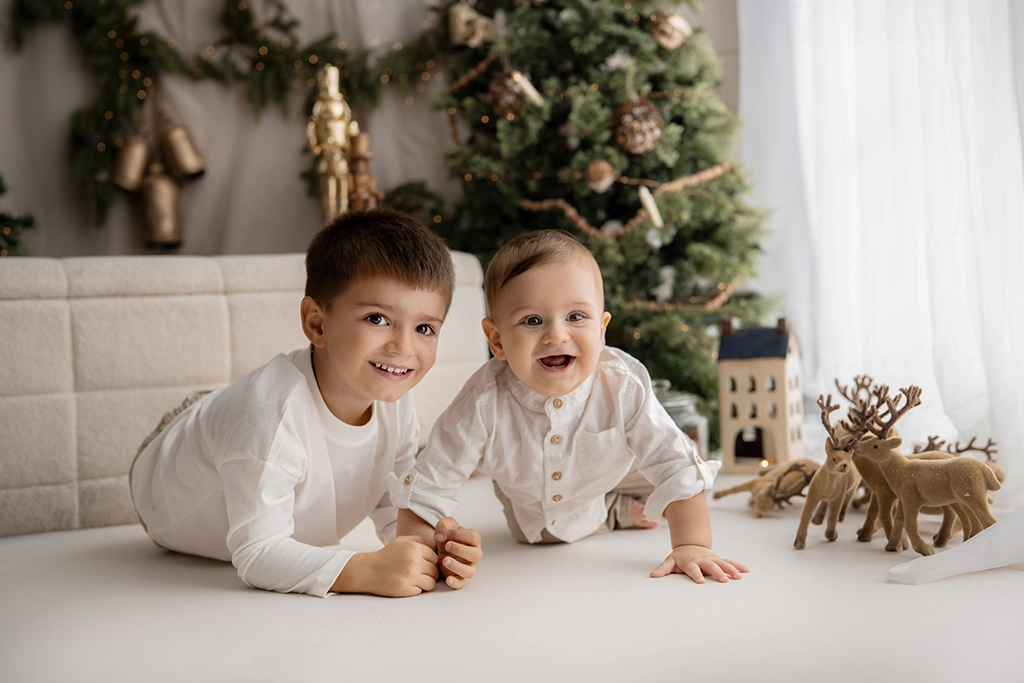 Two brothers lying together in the Christmas setting